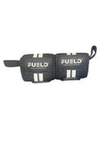 Pair of black wrist wraps with 'FUELD' branding on a dark background