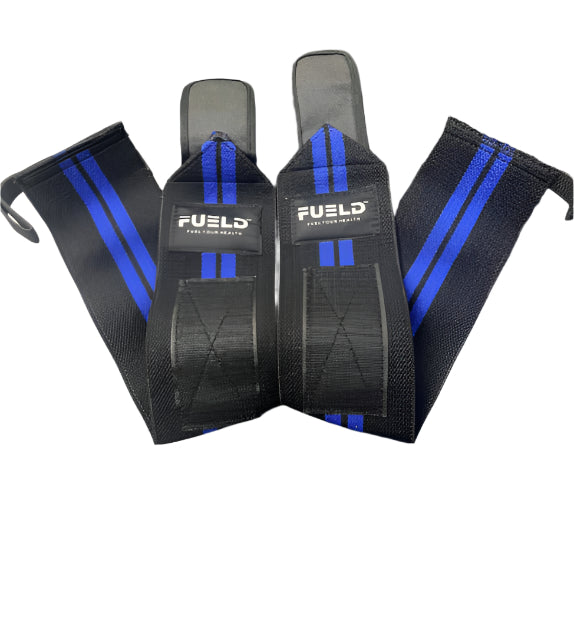 Pair of black wrist wraps with blue straps and 'FUEL' branding on a gray surface.